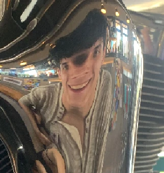 my distorted face into a beer tap at a pub